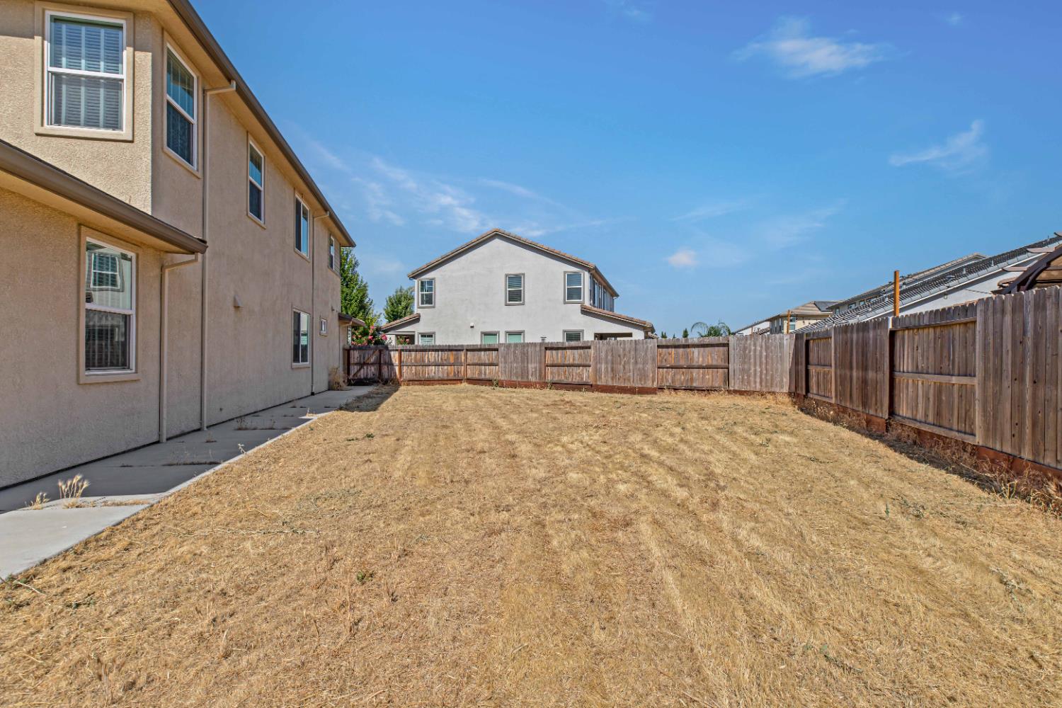 3264 Showcase Way Modesto, CA 95356 - Photo 27 of 31 a large house with a large space in front of it