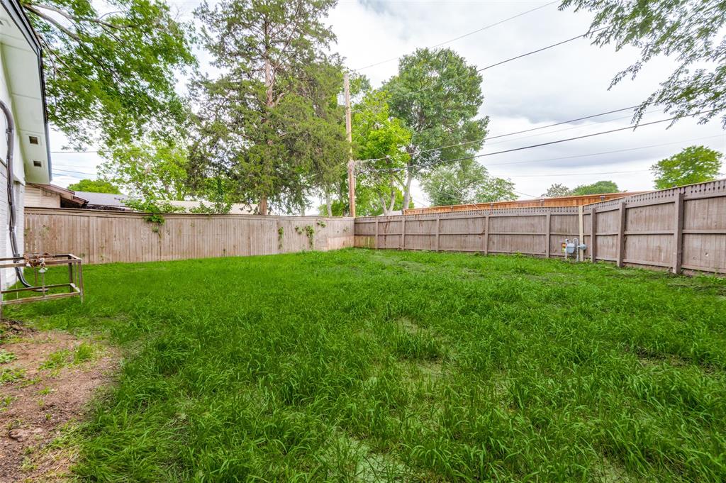 728 Oceanview Drive Dallas, TX 75232 - Photo 23 of 24 a view of a backyard with a garden