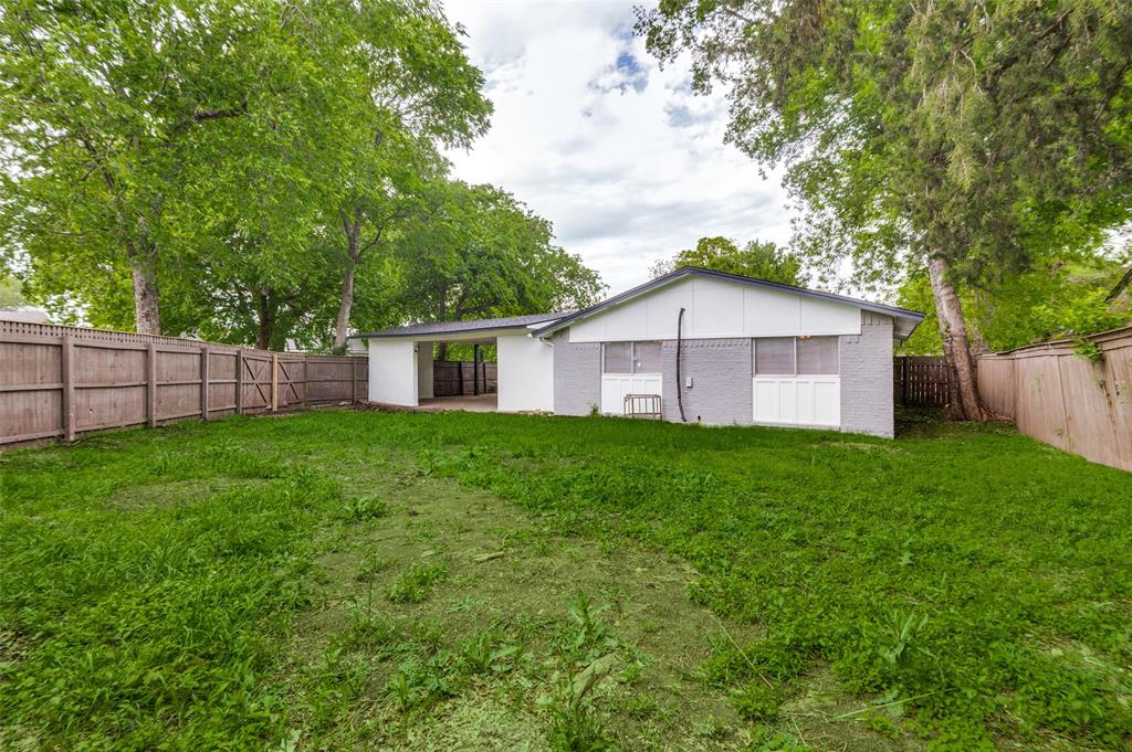 728 Oceanview Drive Dallas, TX 75232 - Photo 24 of 24 a view of a house with backyard and garden