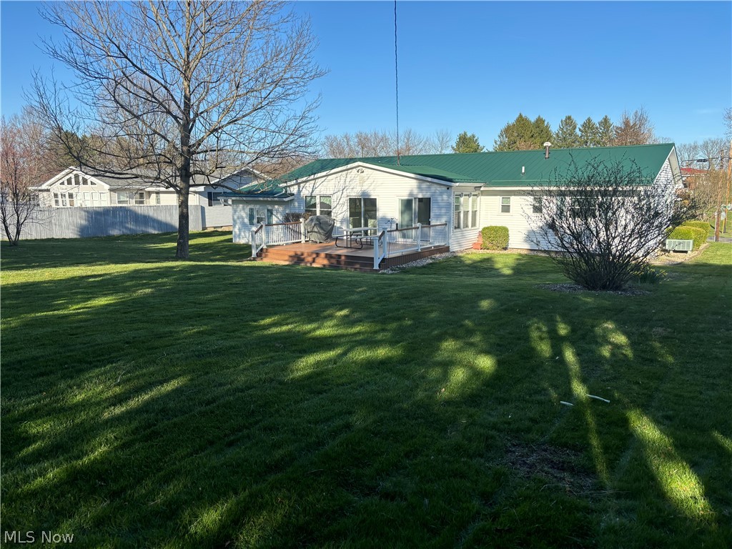 64197 Morrison Road Cambridge, OH 43725 - Photo 8 of 41 Rear view of property featuring a lawn and a deck