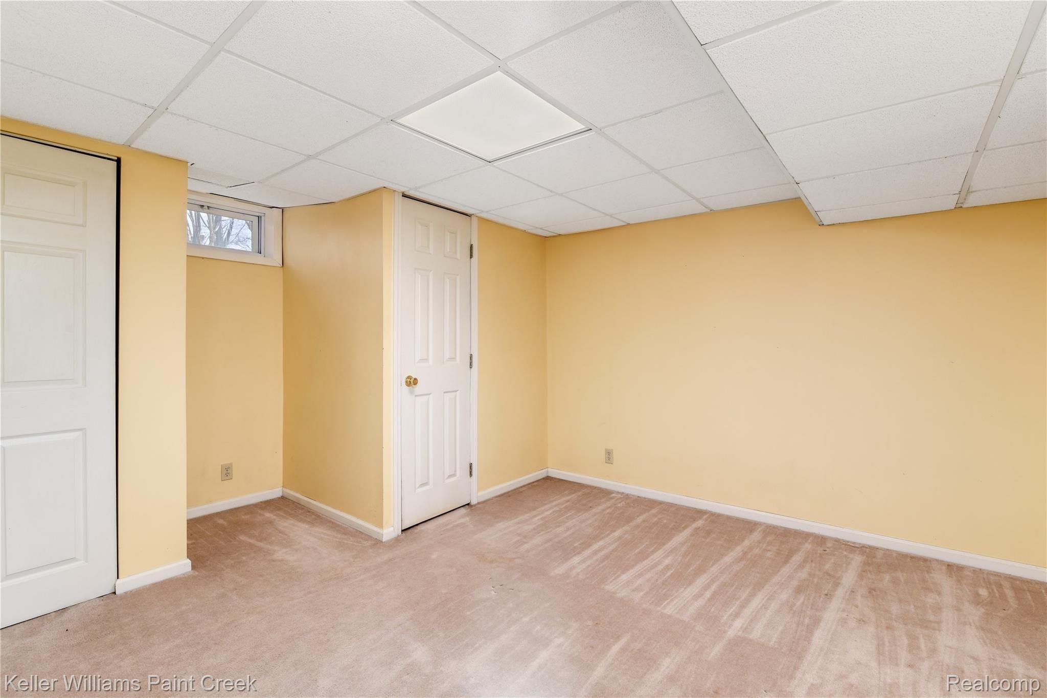 4770 Whipple Lake Road Clarkston, MI 48348 - Photo 14 of 21 Additional room can be used as a potential bedroom or hobby area.