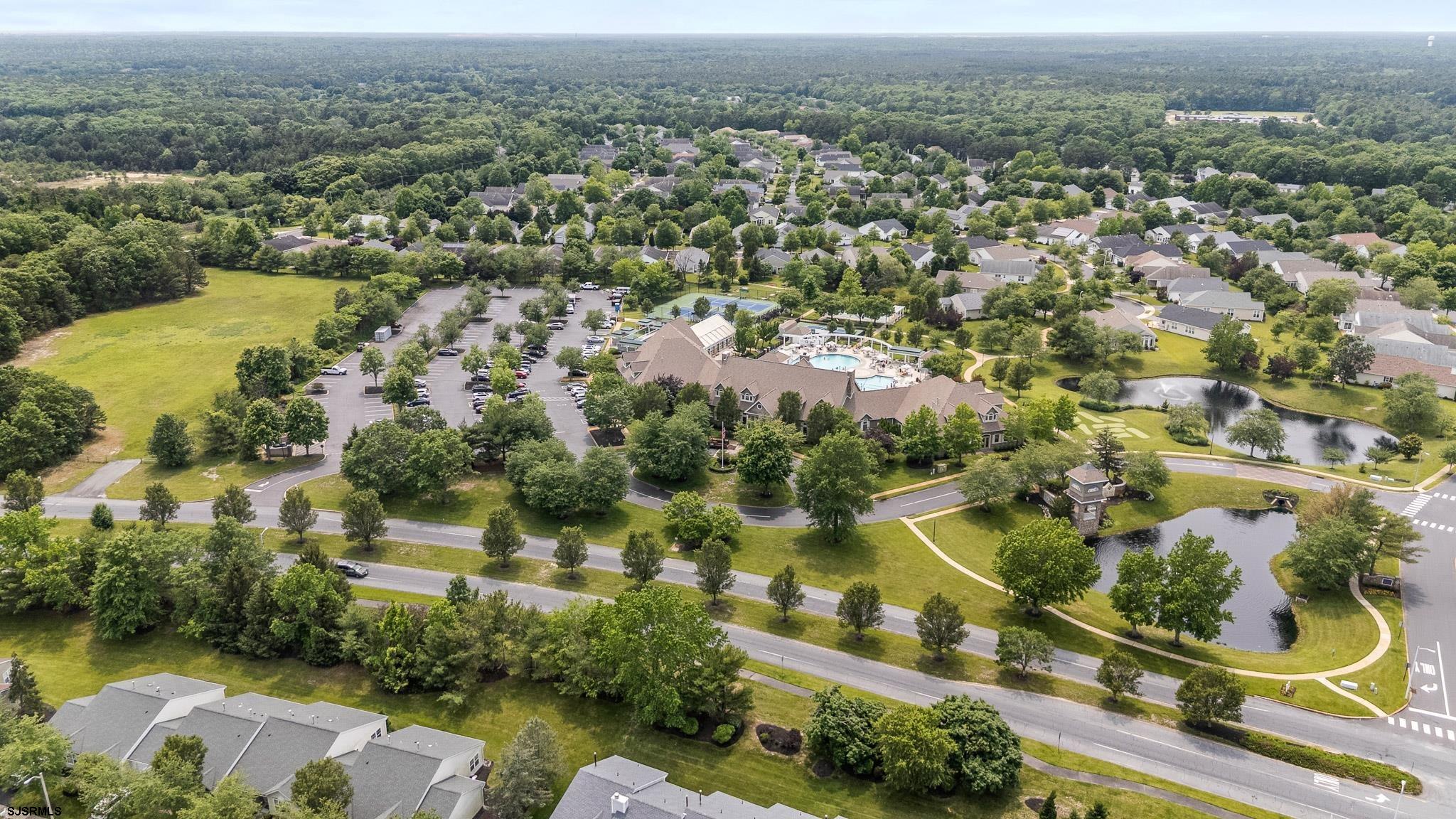 102 Warwick Road Galloway Township, NJ 08205 - Photo 37 of 45 an aerial view of residential houses with outdoor space and swimming pool