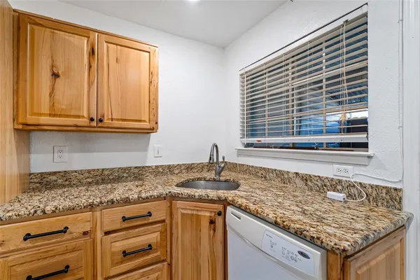 a kitchen with a stove and a sink