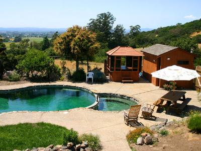 901 Warrington Road Santa Rosa, CA 95404 - Photo 1 of 10 an aerial view of a house with swimming pool patio and lake view
