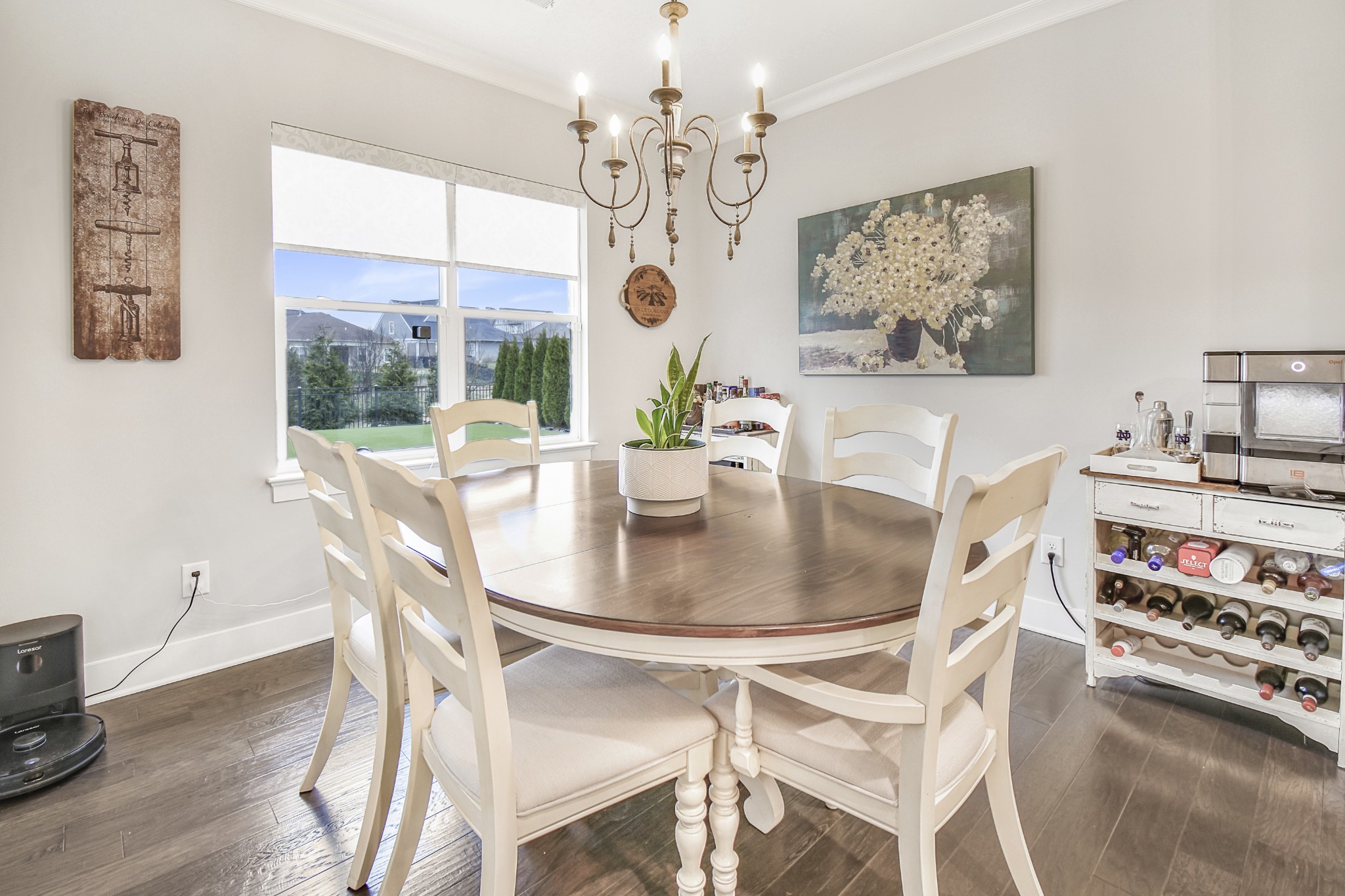 243 Croft Way Mount Juliet, TN 37122 - Photo 10 of 48 a dining room with furniture a painting a chandelier and wooden floor