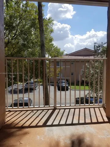 a view of swimming pool with seating area and furniture