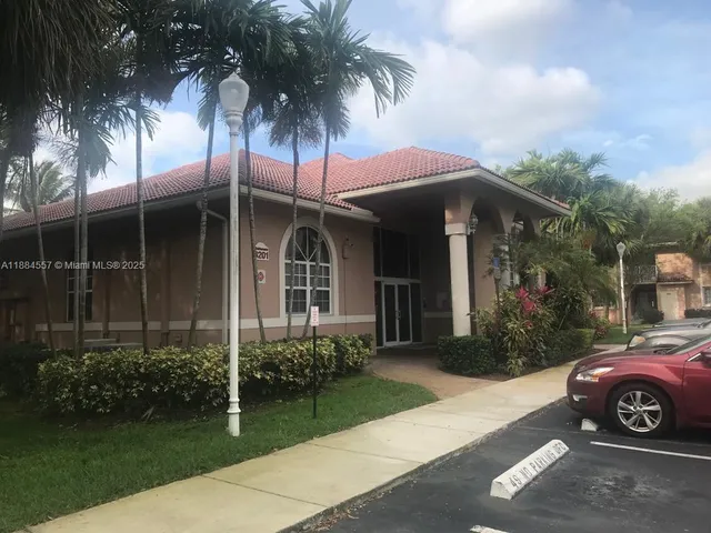 a view of a car parked in front of a house