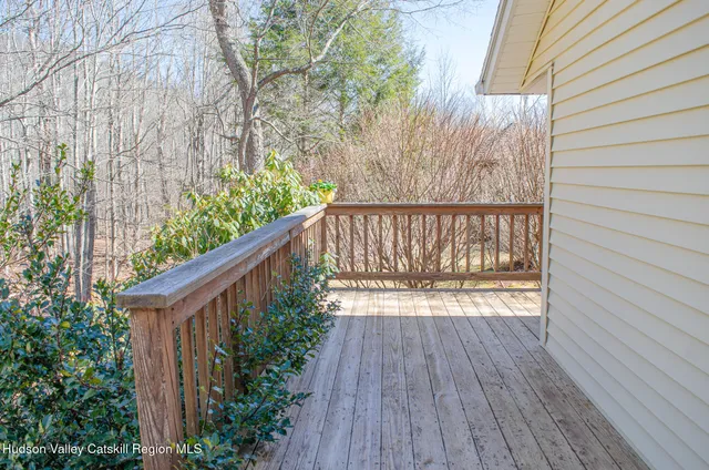 a balcony with wooden floor