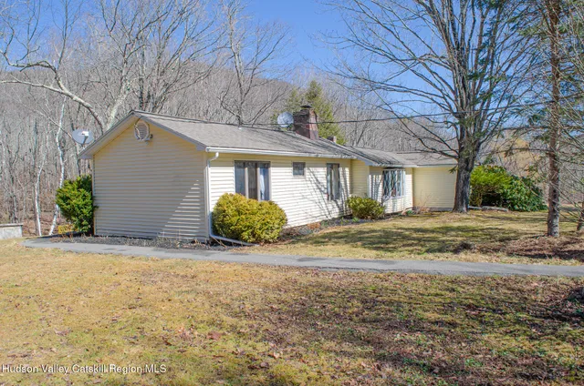 a view of a backyard with trees