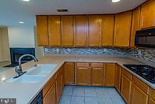 4800 Coyle Road, Unit 209 Owings Mills, MD 21117 - Photo 9 of 38 Fabulous Kitchen Opens to Family Room w/Fireplace