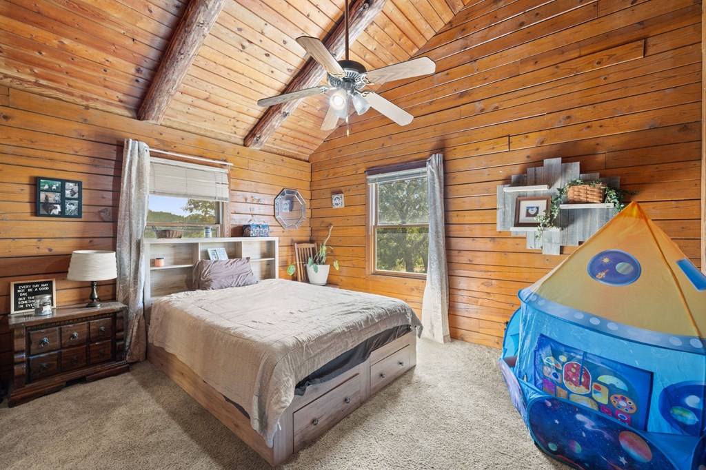 0 F-M 963 Briggs, TX 78608 - Photo 21 of 40 a living room with a bed furniture and a window