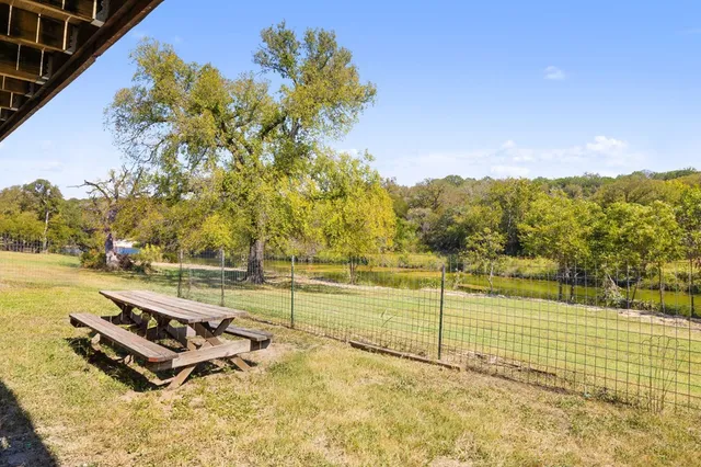 an aerial view of a house with pool ocean view