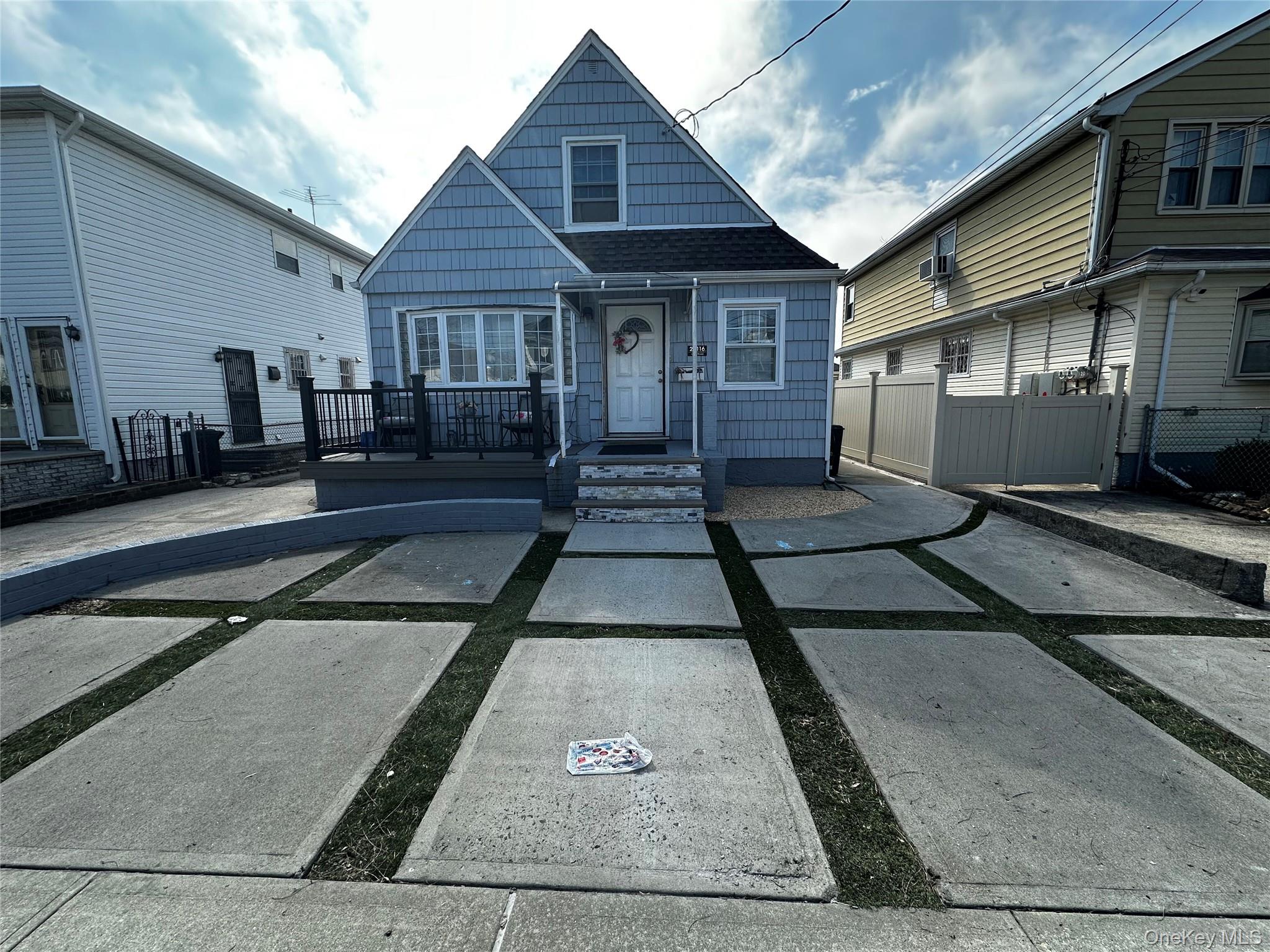 a front view of a house with many windows