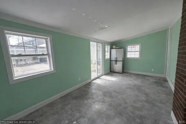 a view of empty room with windows