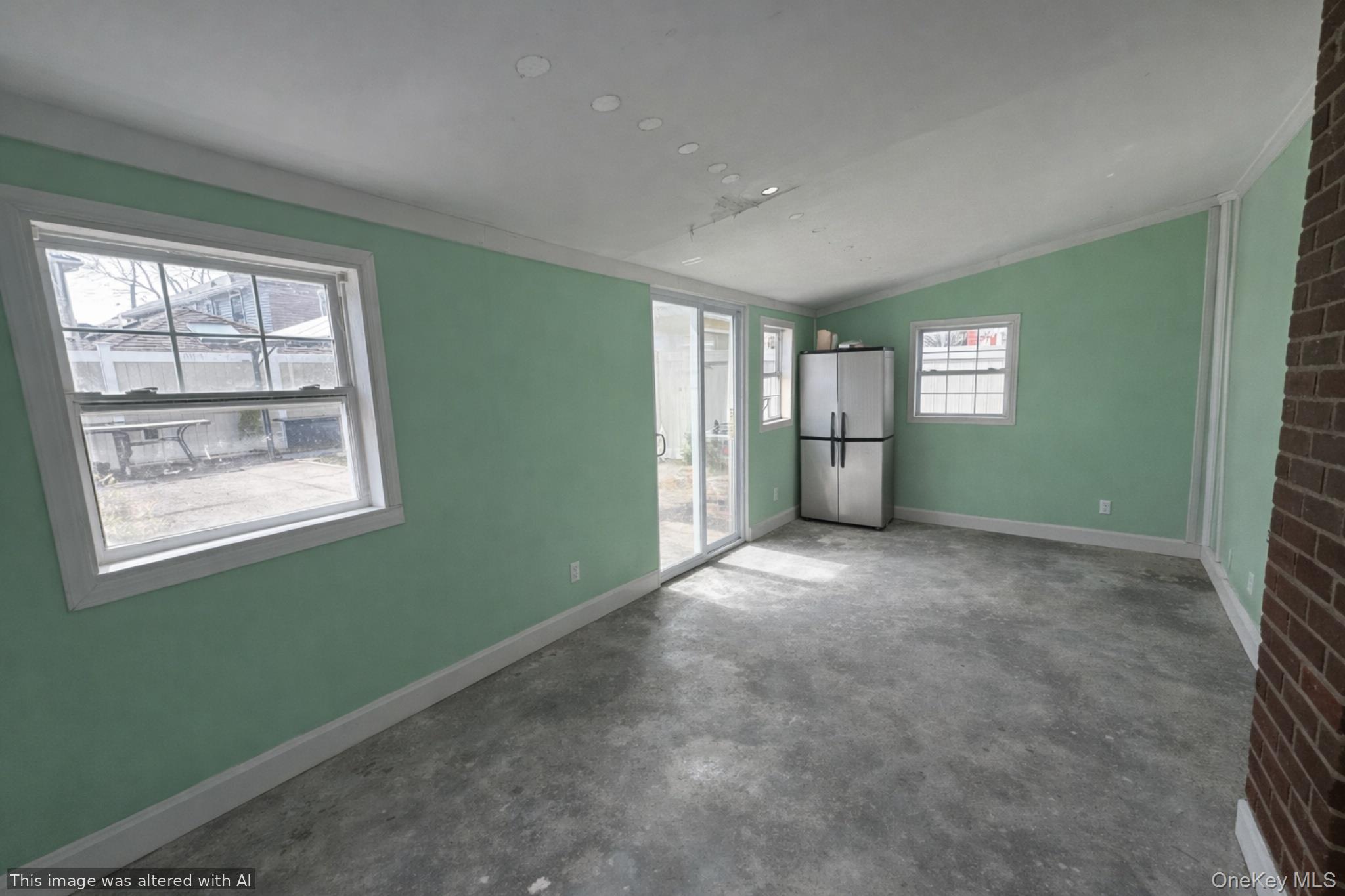 241-16 148th Road Queens, NY 11422 - Photo 11 of 28 a view of empty room with windows