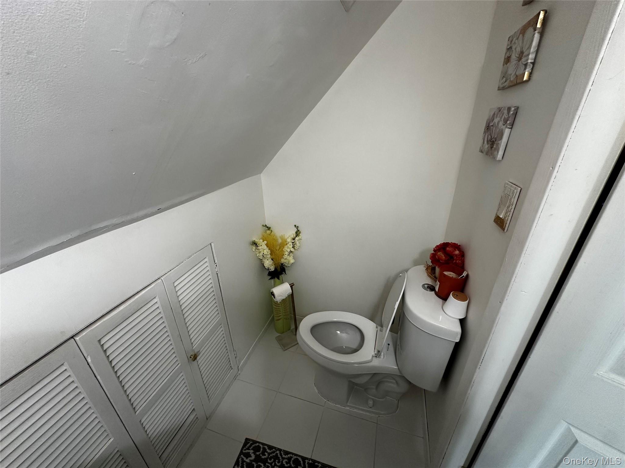 241-16 148th Road Queens, NY 11422 - Photo 19 of 28 a bathroom with a sink and toilet