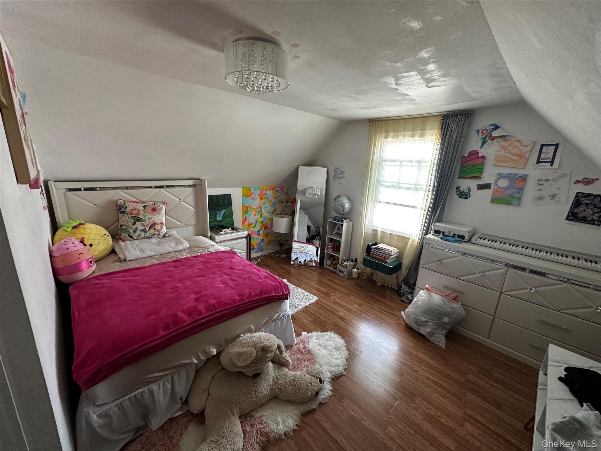 241-16 148th Road Queens, NY 11422 - Photo 22 of 28 a bedroom with furniture and wooden floor