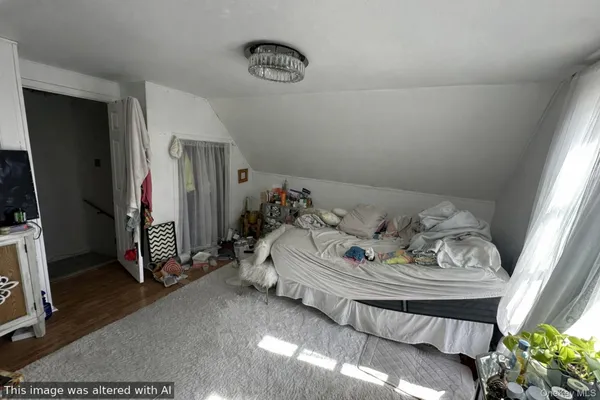 a view of a livingroom with an empty space and a window
