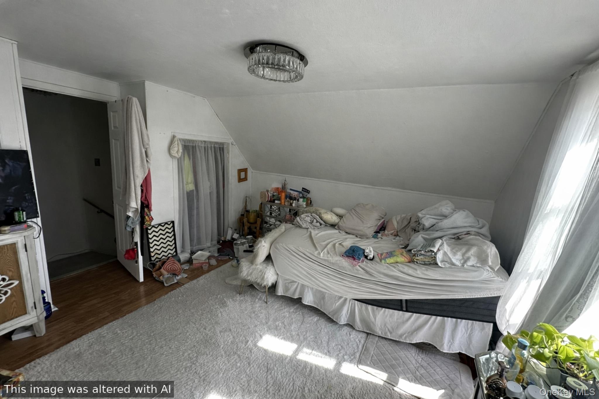 241-16 148th Road Queens, NY 11422 - Photo 23 of 28 a bedroom with bed and gym equipment