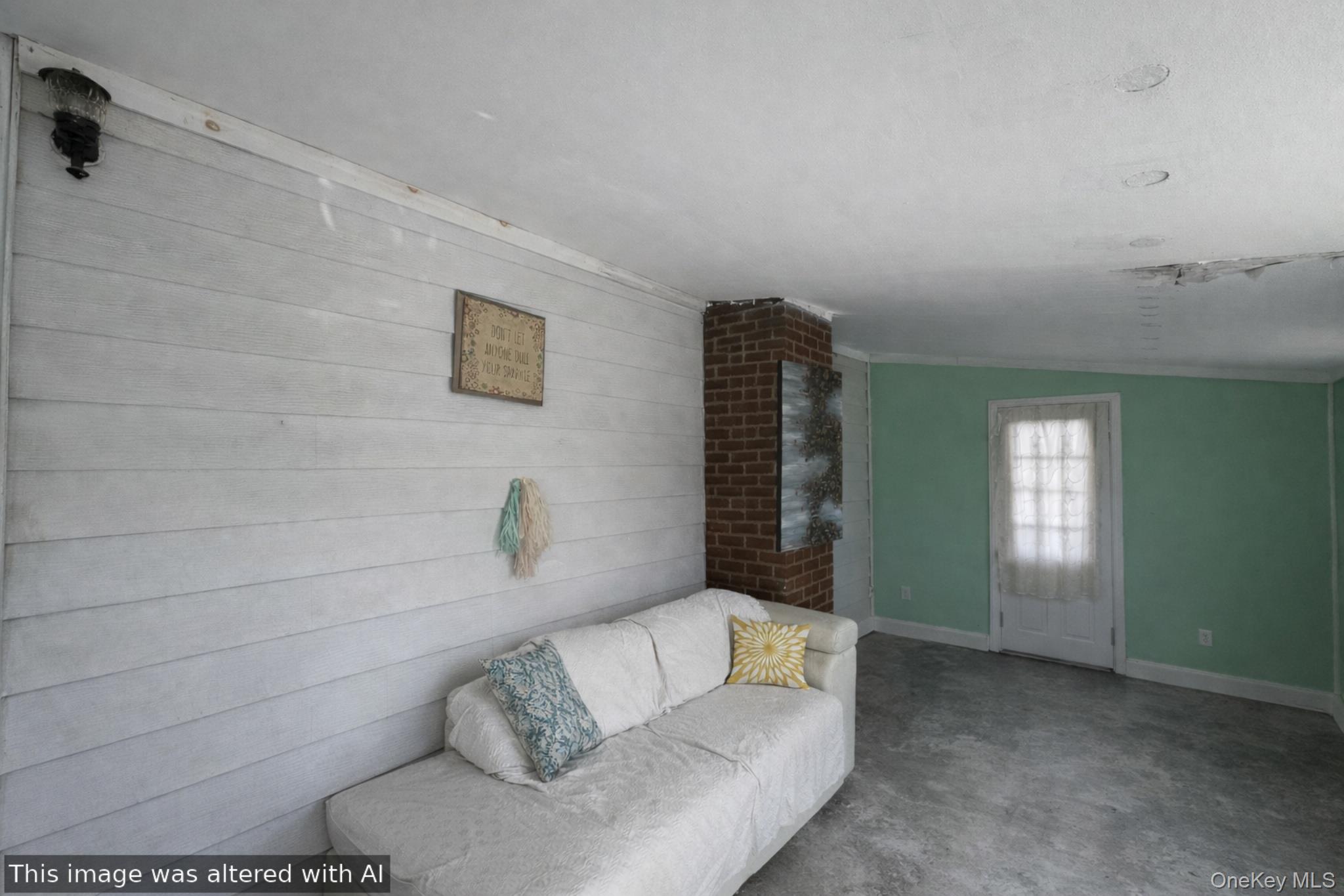 241-16 148th Road Queens, NY 11422 - Photo 10 of 28 a living room with furniture and a window