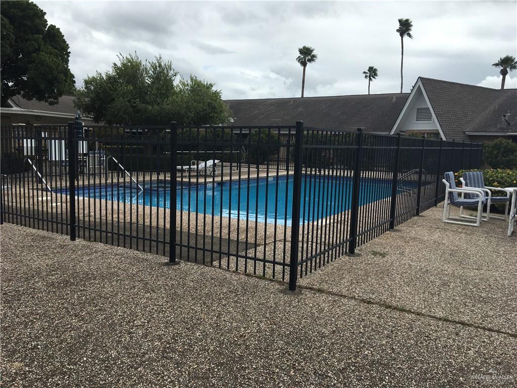 700 Fern Street, Unit 4 McAllen, TX 78504 - Photo 3 of 14 a view of a terrace with iron fence