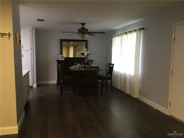 a dining room with furniture and window