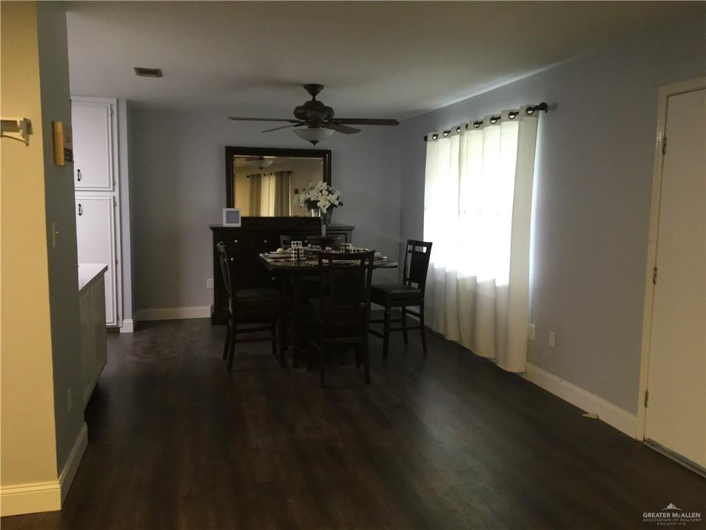 700 Fern Street, Unit 4 McAllen, TX 78504 - Photo 7 of 14 a dining room with furniture and window