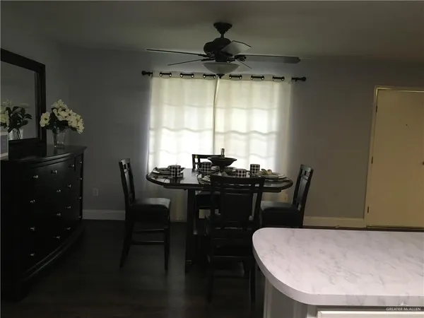 a dining room with furniture and window