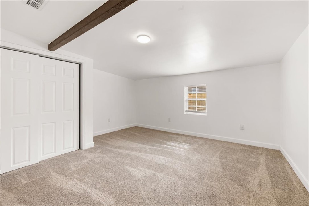 629 Little Meadow Drive Riverside, OH 45404 - Photo 24 of 48 This cozy bedroom features plush carpeting and a bright window, creating a serene and comfortable living space.