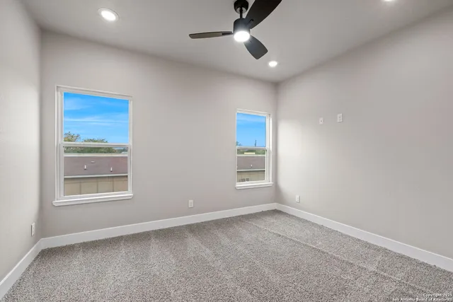 a view of room with window and hardwood floor