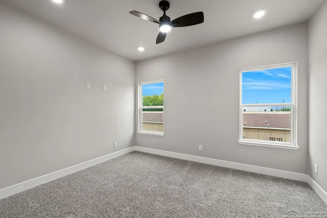 a bathroom with a double vanity sink a toilet and bathtub