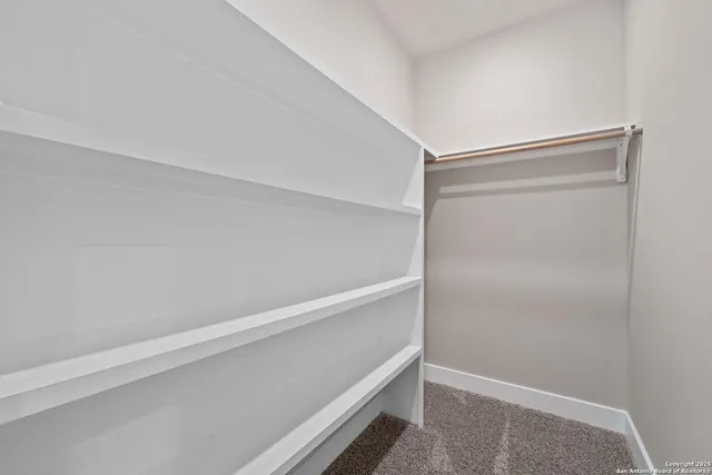 a bathroom with a double vanity sink toilet and a mirror