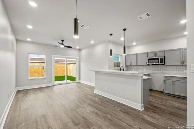 a view of kitchen with wooden floor