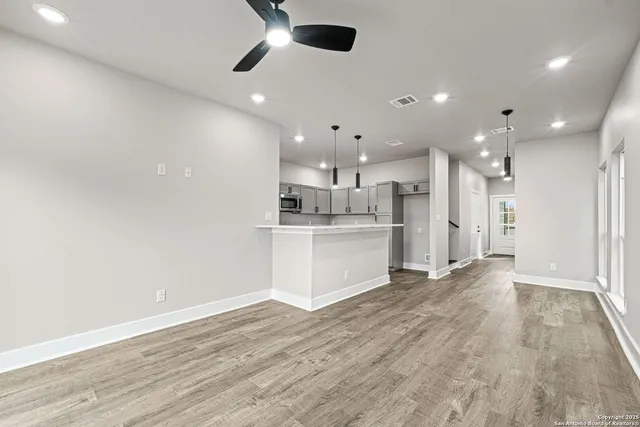 a kitchen with appliances cabinets and a sink