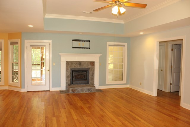 11 Dillard Road Forsyth, GA 31029 - Photo 2 of 14 a view of empty room with wooden floor and fan