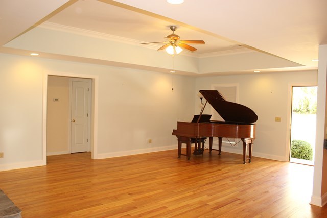 11 Dillard Road Forsyth, GA 31029 - Photo 3 of 14 a view of a room with wooden floor table and chairs