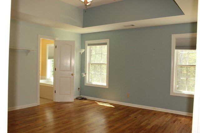 11 Dillard Road Forsyth, GA 31029 - Photo 7 of 14 an empty room with wooden floor and windows
