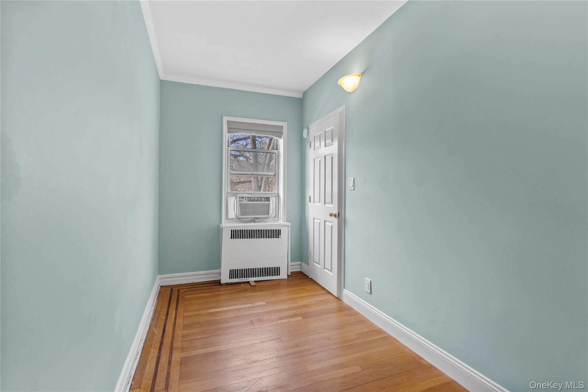 822 Palmer Road, Unit 3B Bronxville, NY 10708 - Photo 11 of 19 a view of a room with wooden floor and a window