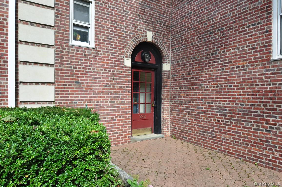 822 Palmer Road, Unit 3B Bronxville, NY 10708 - Photo 17 of 19 a view of a brick house with large windows