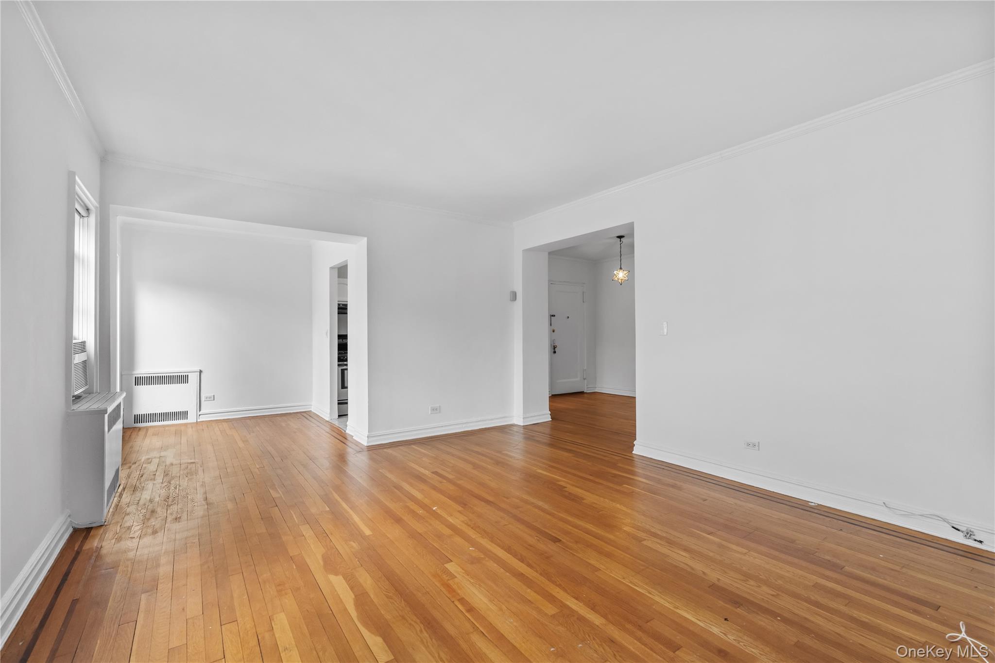 822 Palmer Road, Unit 3B Bronxville, NY 10708 - Photo 4 of 19 a view of an empty room and wooden floor