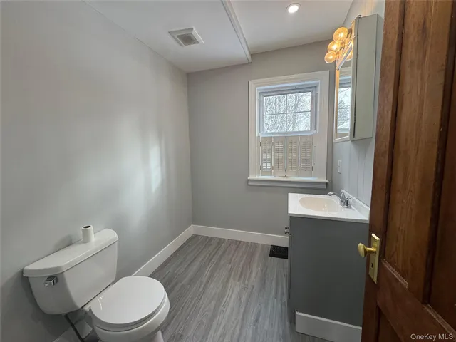 a room with a sink and a mirror