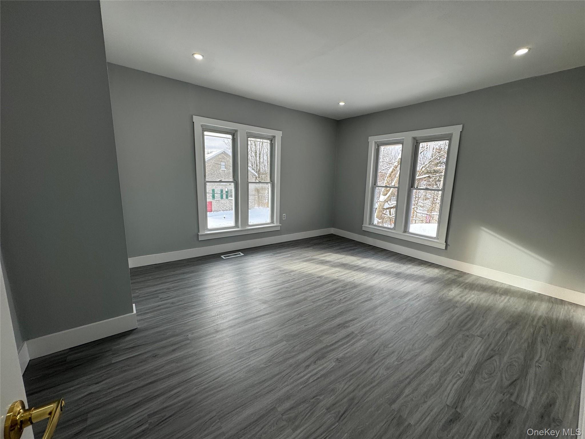 9606 Lincoln Avenue Remsen, NY 13438 - Photo 18 of 43 Spare room featuring dark wood-style flooring and recessed lighting