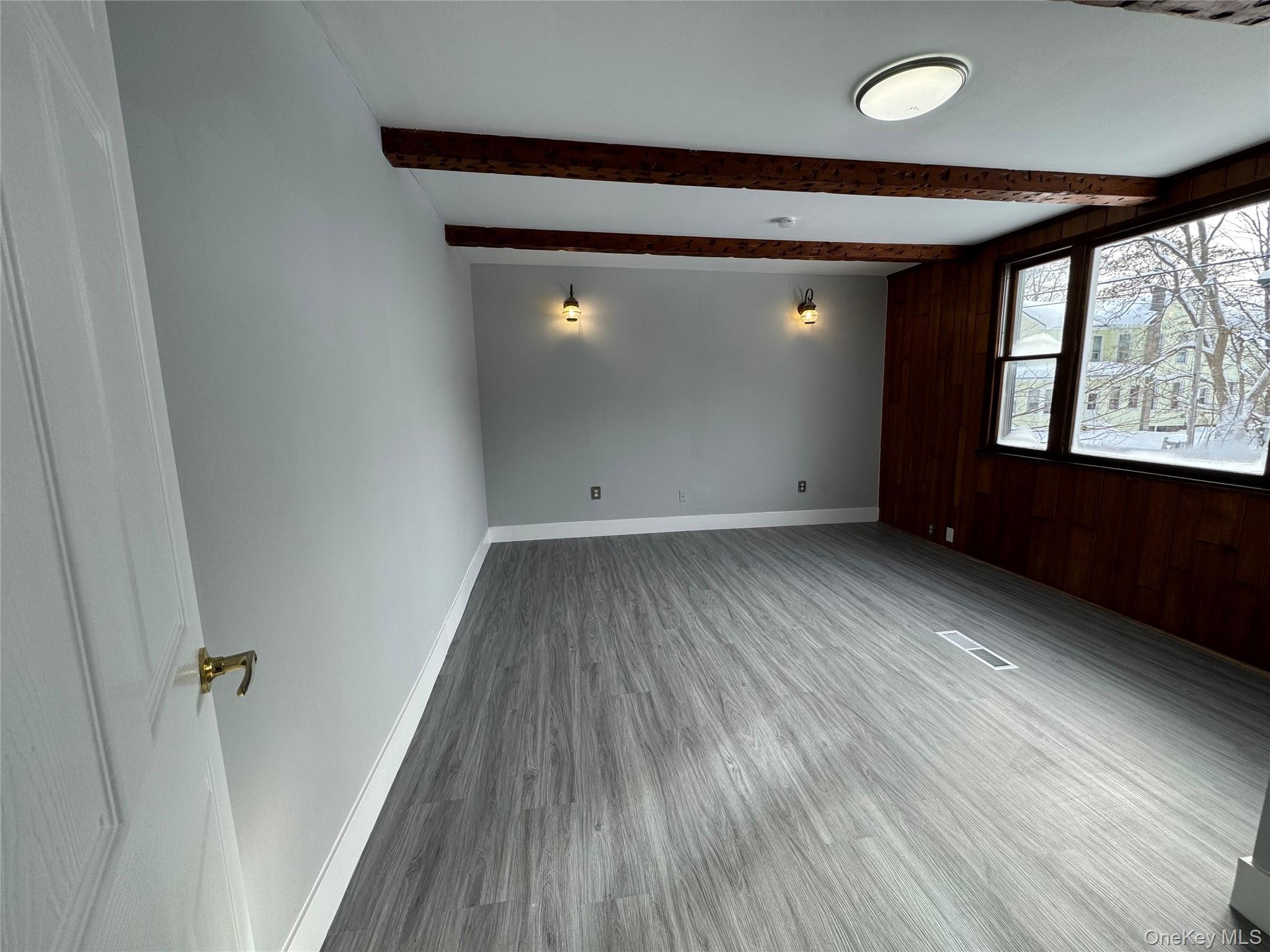 9606 Lincoln Avenue Remsen, NY 13438 - Photo 21 of 47 an empty room with wooden floor and windows