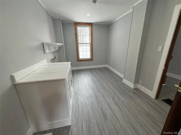 a view of livingroom with hardwood floor and window