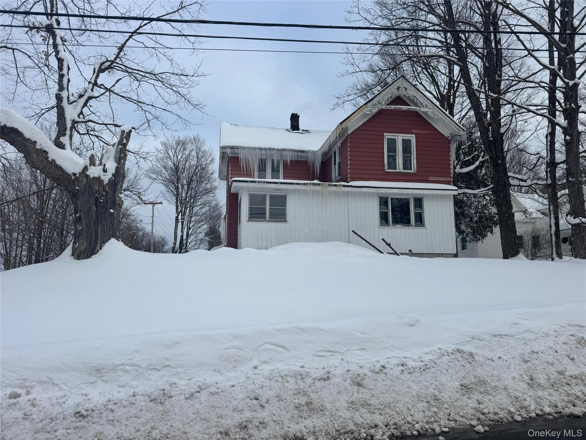 9606 Lincoln Avenue Remsen, NY 13438 - Photo 3 of 47 a front view of a house with a snow in the yard
