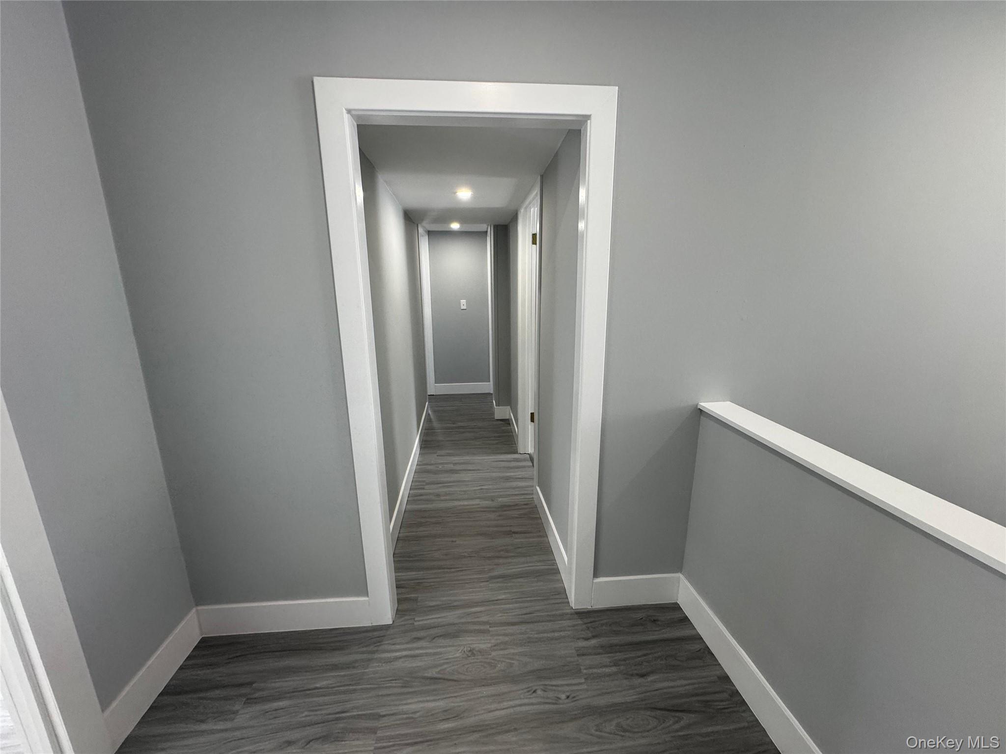 9606 Lincoln Avenue Remsen, NY 13438 - Photo 31 of 43 Hallway featuring an upstairs landing and dark wood-type flooring