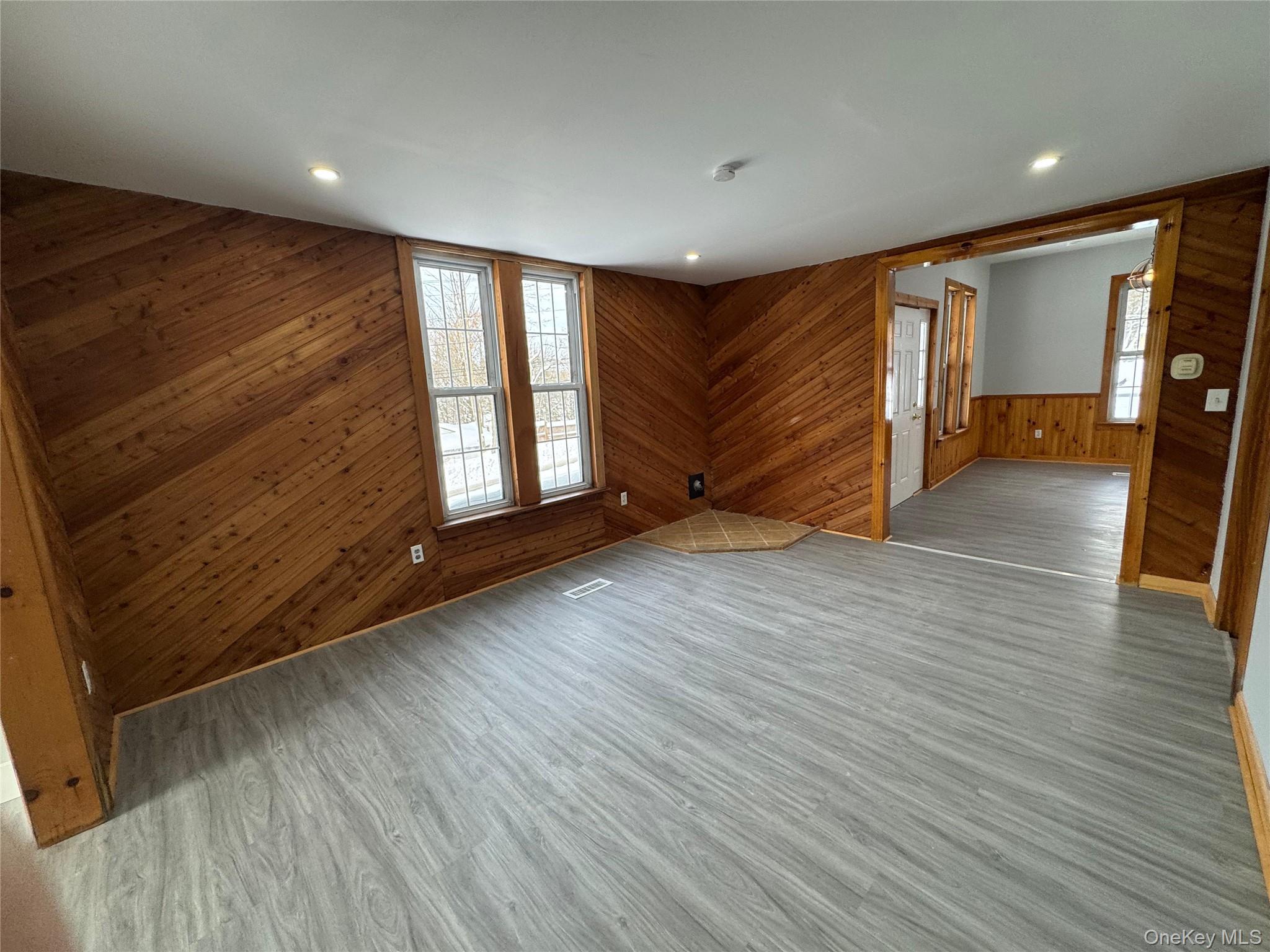 9606 Lincoln Avenue Remsen, NY 13438 - Photo 34 of 47 a view of an empty room with wooden floor and a window