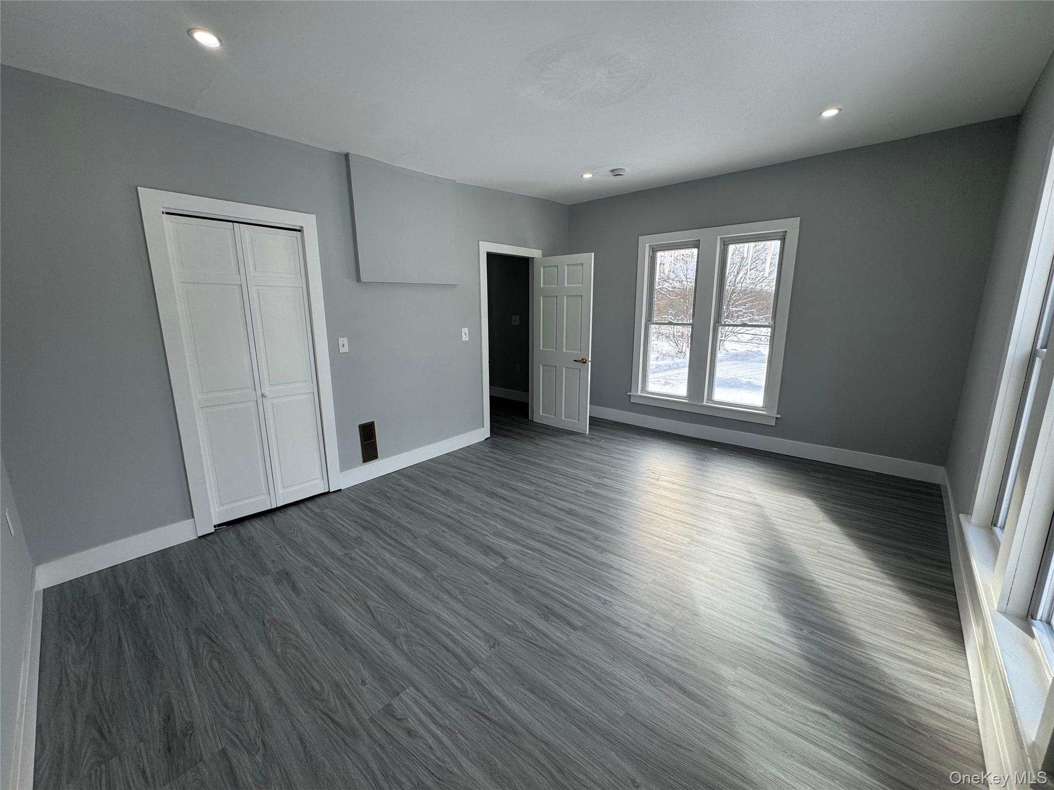 9606 Lincoln Avenue Remsen, NY 13438 - Photo 41 of 47 an empty room with wooden floor and windows