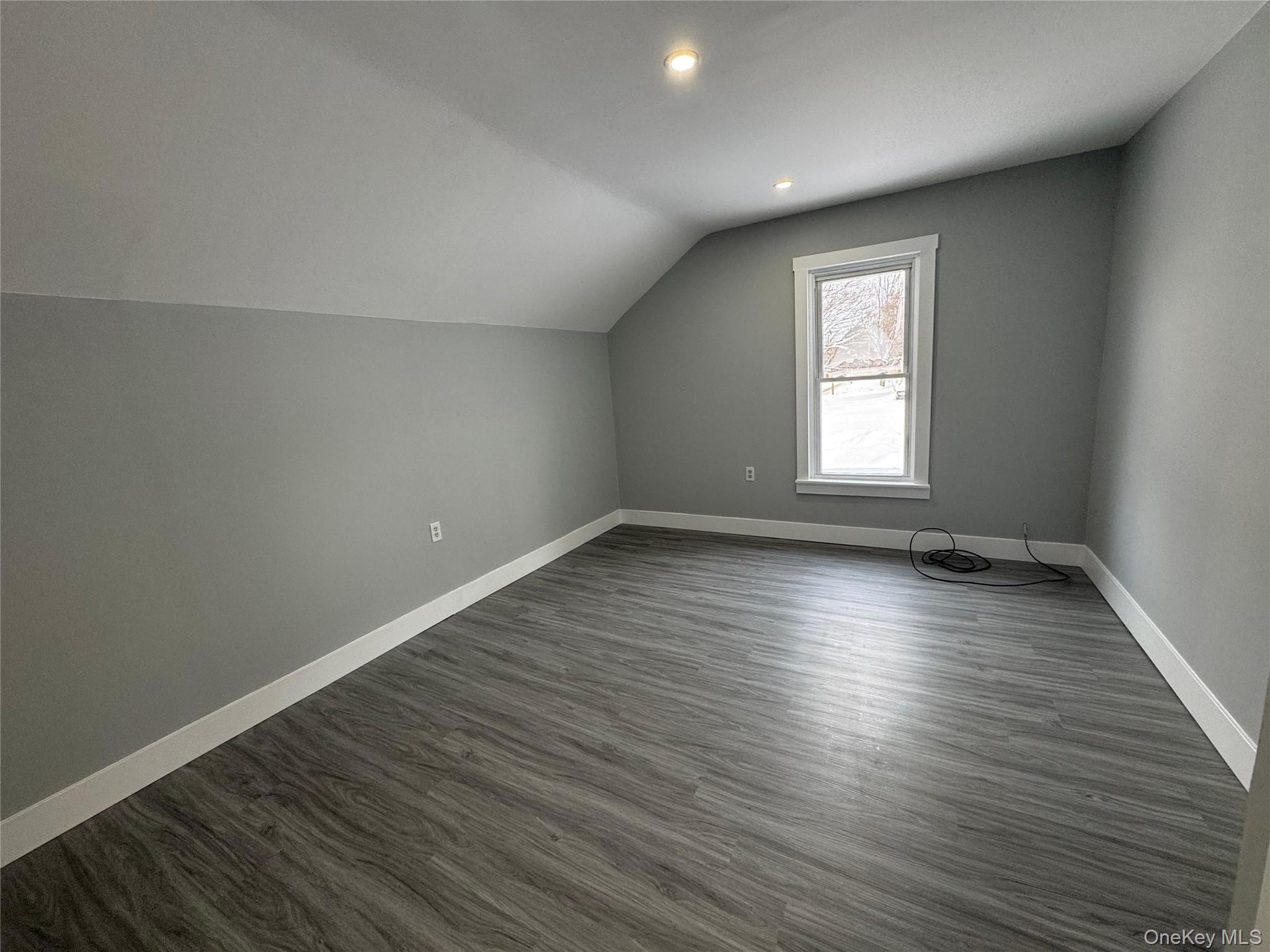 9606 Lincoln Avenue Remsen, NY 13438 - Photo 41 of 43 Additional living space with dark wood-style floors, lofted ceiling, and recessed lighting