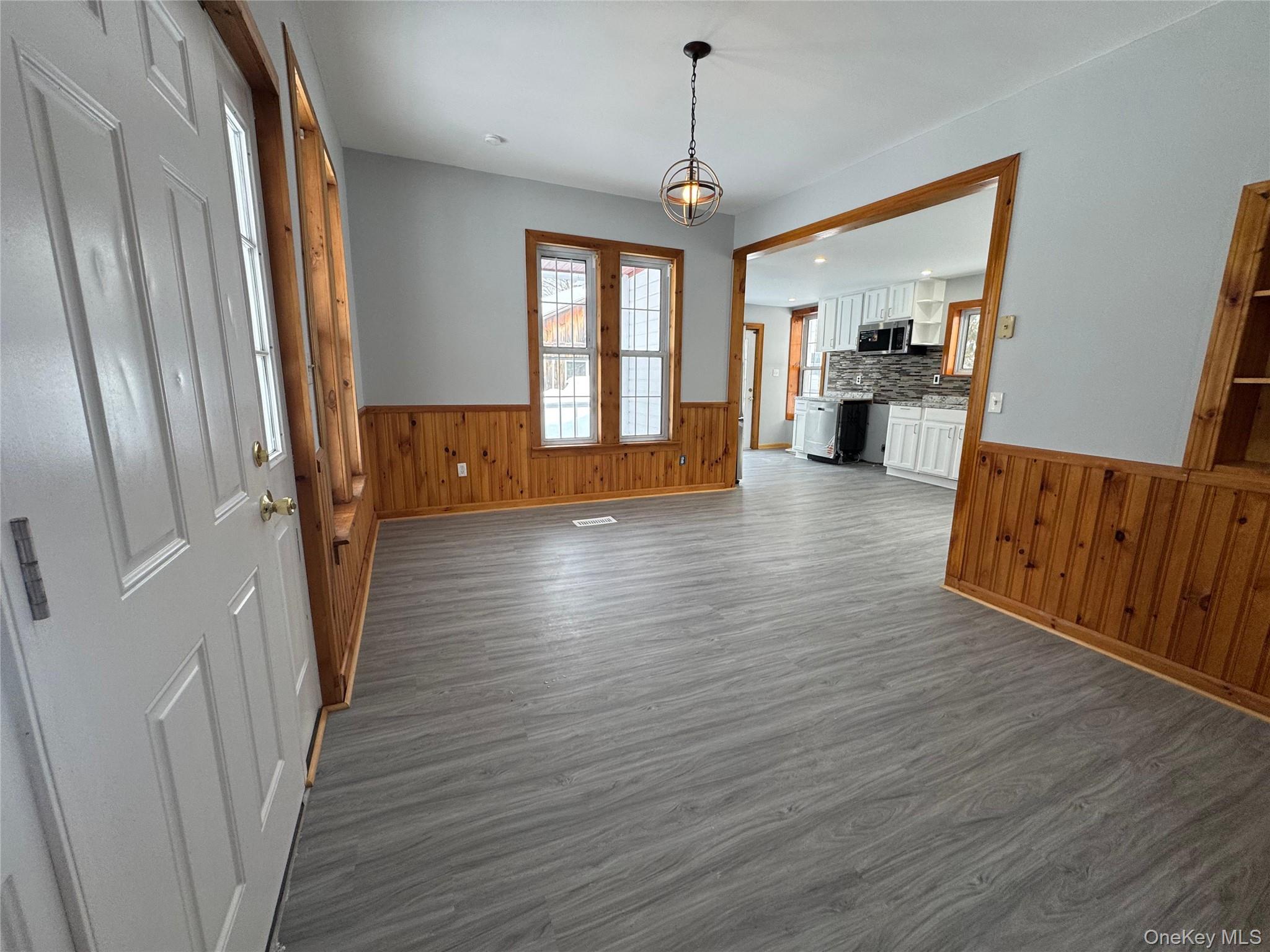 9606 Lincoln Avenue Remsen, NY 13438 - Photo 5 of 47 a view of an empty room with wooden floor and a window